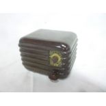 An old Silvertone small transistor radio in bakelite angular case