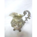 A 19th Century Swedish silver tapered jug with raised scroll decoration and scroll handle,