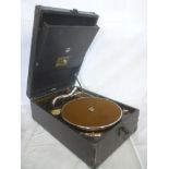 An HMV Model 101 portable tabletop gramophone with chromium plated mounts
