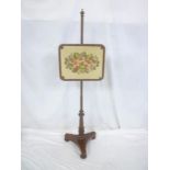 A 19th mahogany pole screen with floral tapestry rectangular panel on tripod base