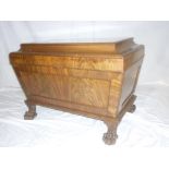 An early 19th Century mahogany rectangular sarcophagus-shaped wine cooler with adapted interior
