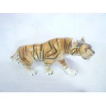 A large Royal Dux china figure of a prowling tiger 17" long