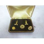 A pair of 9ct gold adjusting cufflinks set black stones,