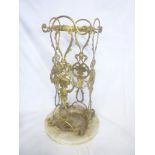 A good quality brass circular stick stand with raised and pierced decoration and marble circular