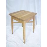 An Arts and Crafts oak square occasional table on tapered legs