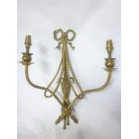 A good quality brass two-section wall light with ribbon and ram's head decoration