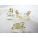 A 19th Century Staffordshire china figure of a poodle with bird on rectangular cushion base;