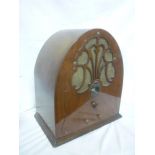 An old Philco model 20 radio in polished mahogany arched case