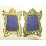 A pair of Edward VII Art Nouveau-style silver mounted photo frames with raised floral and stylized