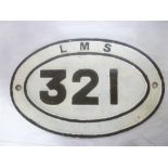 An old painted iron oval LMS railway engine plaque "321",