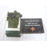 A British Armoured vehicle/ tank periscope dated 1973 and a military passenger vehicle First Aid