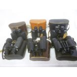 Six pairs of cased binoculars including 10 x 50 by Kent Precision Optics; 10 x 50 by Zenith;