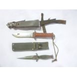 A Military Services survival knife with painted alloy hilt in composition sheath and one other