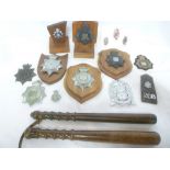 A collection of various Police helmet plates and badges including George V Metropolitan Police