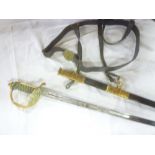 A George V Naval officers sword with etched steel blade, brass folding guard,