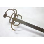 A 17th Century style swept hilt rapier sword with 33" single-edged blade and iron hilt in excavated