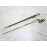 An 1853 pattern Enfield steel socket bayonet with triangular tapered blade in brass mounted leather