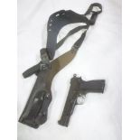 A replica Browning semi-automatic pistol and a Browning leather shoulder holster