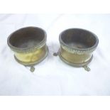 A pair of First War brass Trench Art shell case bowls dated 1916 on paw feet