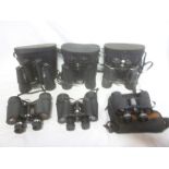 Six pairs of binoculars including 30 x 50 by Mark Scheffel; Regent 7 x 50; Tasco 20 x 50;