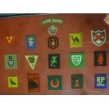 A display of copy Cornwall Home Guard badges - Fifteen embroidered cloth badges including River