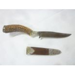 An old German hunting knife with single edged steel blade,