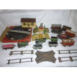 Hornby O gauge - a large box containing two engines, wagons, boxed items, track, level crossing,