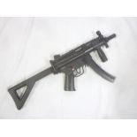 A replica CO2 powered HKMP5 BB gun