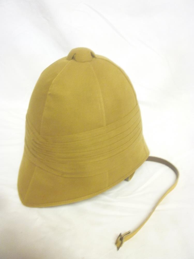 A copy Boer War khaki sun helmet with liner and chin strap