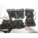 Six pairs of binoculars including 10 x -30 x 50 zoom by Mark Scheffel; Uniscope 10 x 50;