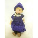 A German porcelain headed doll by Heubach Koppelsdorf Germany with cloth body and porcelain lower