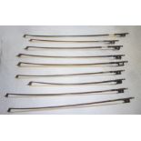 Nine various violin and cello bows