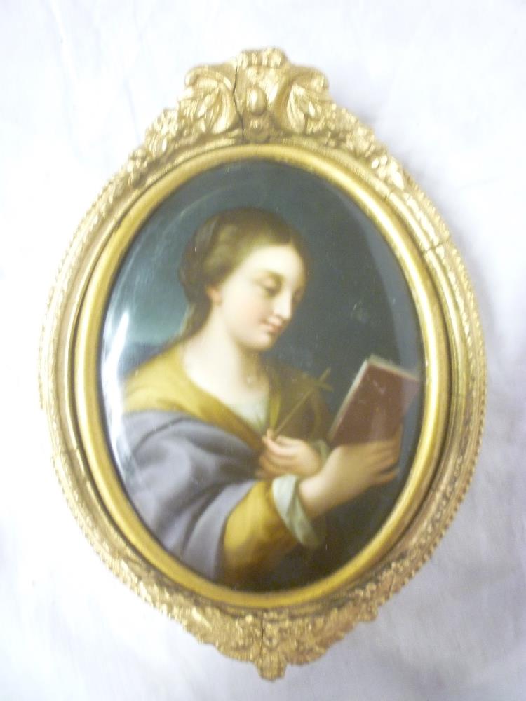 A 19th Century Continental porcelain oval plaque depicting Joan of Arc in gilt oval frame