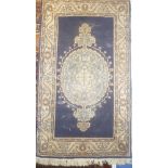 A 19th Century Eastern hand-knotted wool rug with geometric decoration on blue ground 63" x 36"