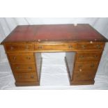 A Victorian walnut rectangular writing desk with three drawers in the frieze,