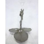 An Art Nouveau pewter table centre with entwined stems supporting a glass trumpet spill on triple
