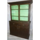 A 19th Century pine kitchen dresser with two drawers in the frieze and cupboard enclosed by two