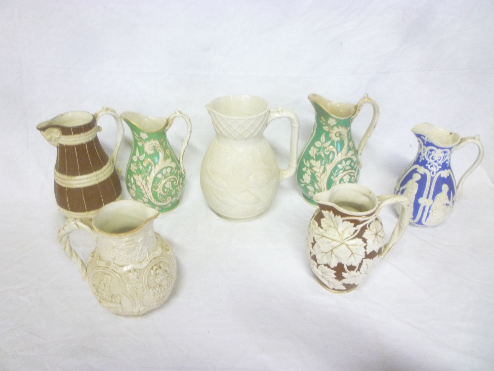 Seven various 19th Century pottery jugs including Victorian British Empire white glazed jug with