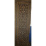 A 19th Century Eastern hand knotted wool runner with floral decoration on blue ground (af) 170" x