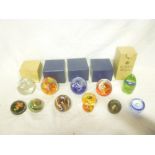 Ten various glass paperweights including Mdina, Manson, Kosta Boda and others,