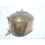 A large 19th Century brass mounted copper oval boiler with oval lid and brass base tap