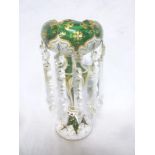 A Bohemian green and white tinted glass table lustre with tapered stem and circular base supporting