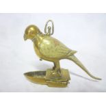 An unusual brass hanging open-flame oil lamp in the form of a parrot