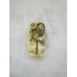 A 19th Century Japanese carved ivory netsuke in the form of a classical tradesman,