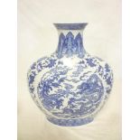 A large 20th Century Chinese flask-shaped vase with blue and white dragon scene decoration 18½"