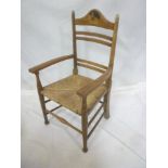 An early 20th Century oak nursery child's-size carver chair,