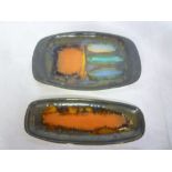 Two Cornish Leaper pottery oval dishes with multi-coloured decoration