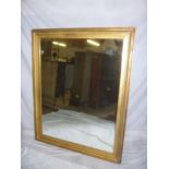 A rectangular wall mirror in gilt frame,