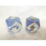 A pair of 19th Century Japanese rhomboid spill vases with painted floral panels