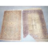 An Eastern hand-knotted wool rug with geometric decoration on blue and brown ground 47" x 29" and